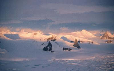 A close up of a snow covered mountain.