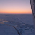 A sunset over some water.