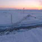 A close up of a snow covered slope.