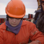 A group of people wearing hard hats