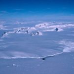 A close up of a snow covered mountain.