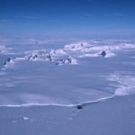 A close up of a snow covered mountain.