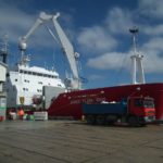 A large ship in the background.