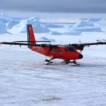 A airplane that is covered in snow.