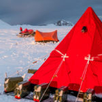 A red tent in a snowy landscape