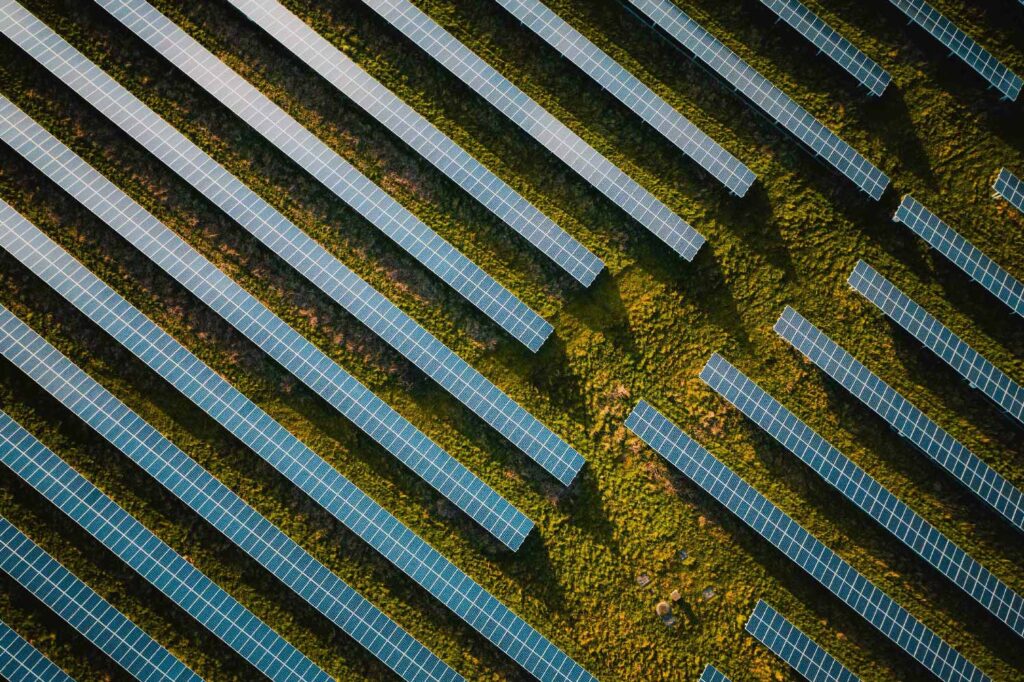 An aerial view of solar panels in a field.