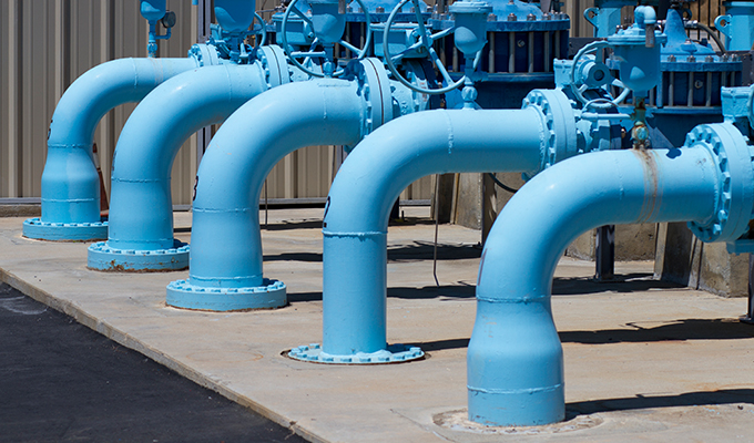 water distribution system pipes leading from out the plant and down to the ground