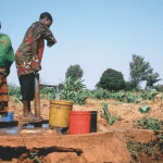 Pumping drinking water from a shallow groundwater source in Tanzania