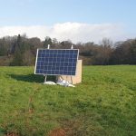 An array of solar panels in a field