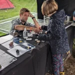 Hydrogeologist Jon MacKay interacting with the public at the bluedot stand. BGS © UKRI.