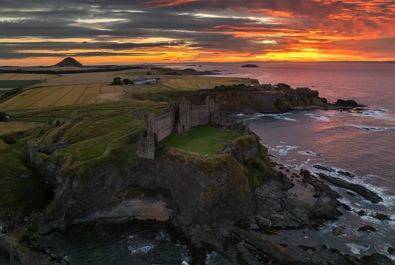 Aerial view of Tantallon Castle, with its distinctive red sandstone curtain wall. © Historic Environment Scotland.