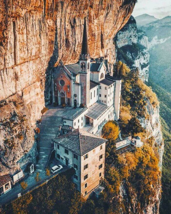 Majestic church built into a massive cliff, showcasing an impressive architectural feat for those with megalophobia.