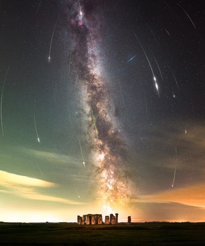 Milky Way galaxy towering above Stonehenge, a stunning sight for those with megalophobia.