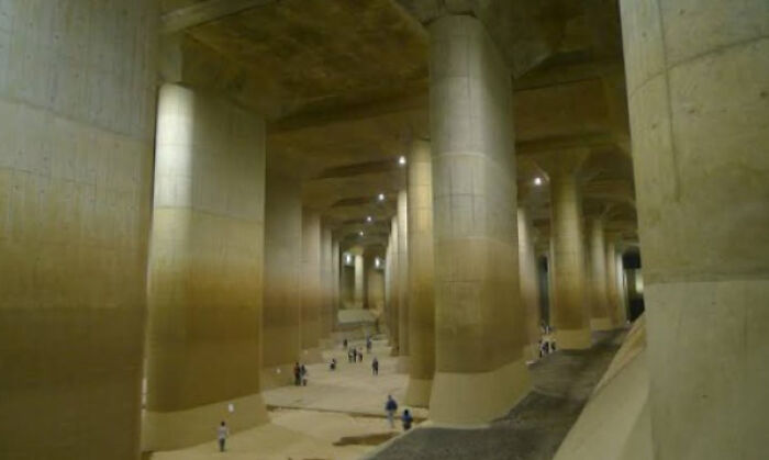 Gigantic underground structure with towering columns, illustrating a megastructure that might trigger megalophobia.