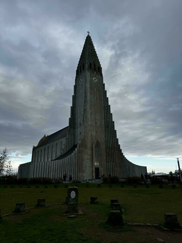 Hallgrimskirkja In Reykjavik, Iceland, Even With Cloudy Skies, It Stands Out As An Enchanting Sight