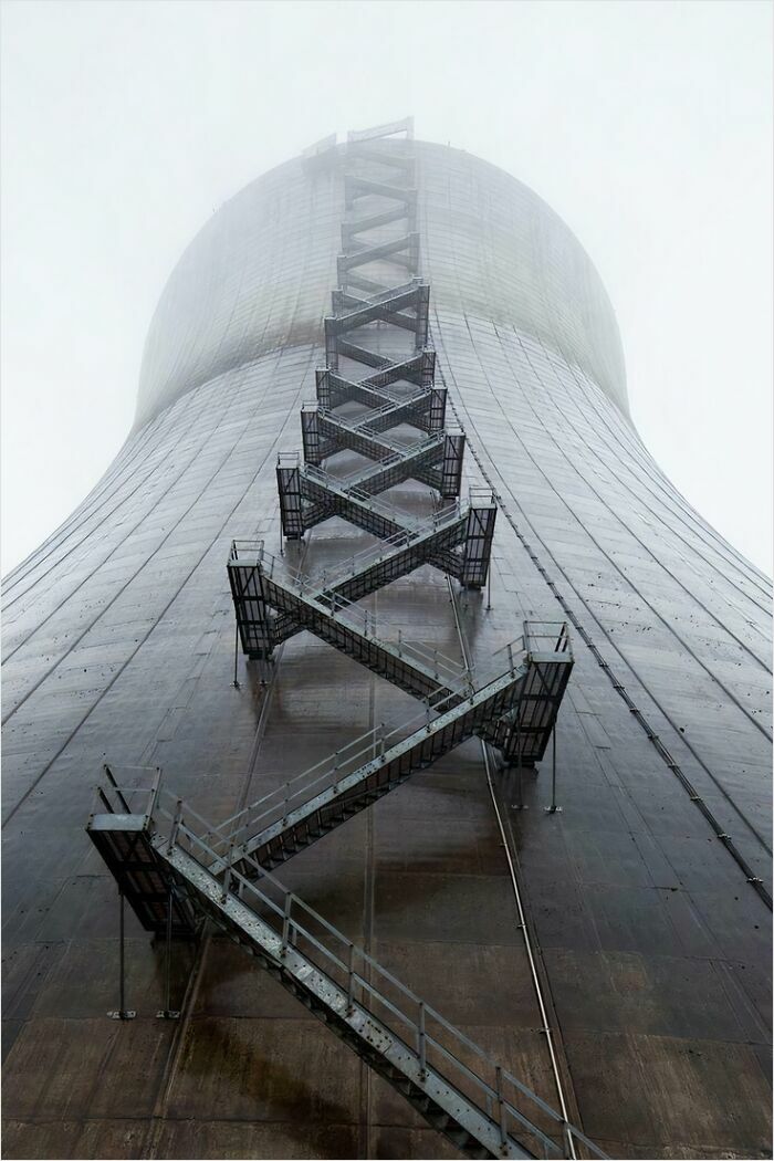 Staircase on a massive cooling tower, showcasing a terrifying view for those with megalophobia.