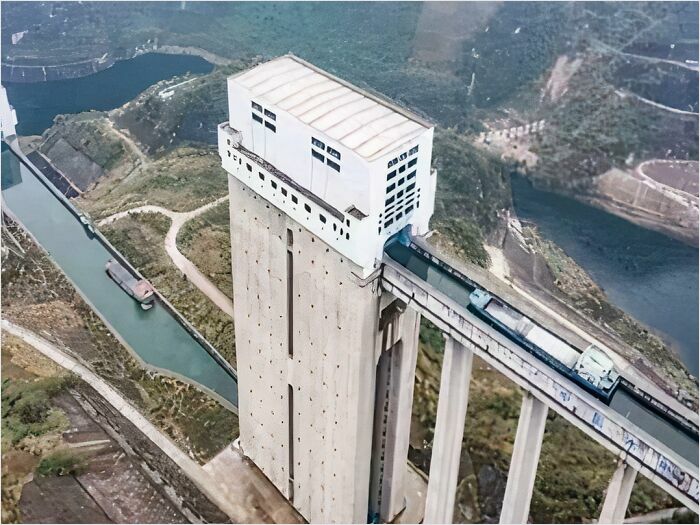 Gigantic boat lift towering over canal and landscape, highlighting megaphobia-inducing scale.