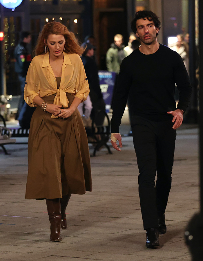 Blake Lively and Justin Baldoni walking outdoors at night on the set of 'It Ends With Us.