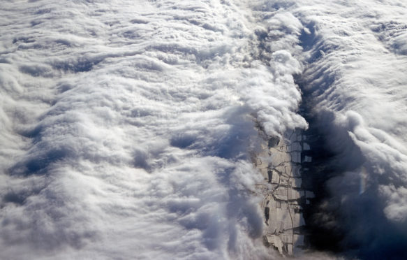 B6P8JD Aerial view of dramatic white clouds against a blue sky