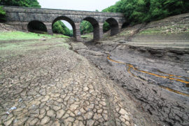 PAGGF2 Lancashire, UK. 21 July 2018. The Reservoir is now showing very low levels due to a sustained dry period, and is shown here after 2 days of rain. United Utilities who own the reservoir intend to introduce a hosepipe ban from 5 August 2018. The reservoir supplies Liverpool via a series of reservoirs in the Rivington area, which were recently used to supply water for helicopters fighting the Winter Hill fires. The bridge shown is the Alance Bridge, which spans the River Yarrow, which would normally flow through it into the reservoir. Credit: Phil Taylor/Alamy Live News