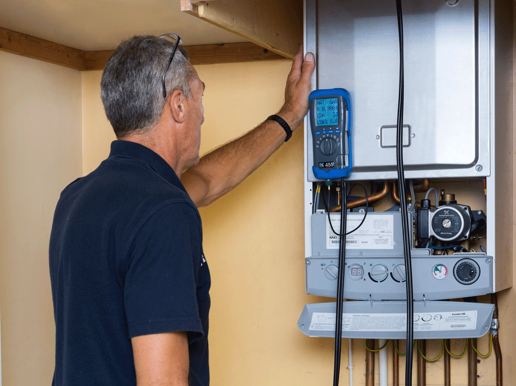 Checking carbon monoxide and flue gas emissions on a domestic gas boiler, UK