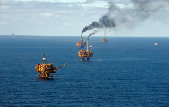 Oil platforms flaring in Brent Oil Field, North Sea