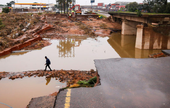 A damaged bridge caused by flooding near Durban, South Africa, 16 April 2022. Credit: Reuters / Alamy Stock Photo. 2J4KM20