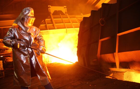 A steel worker at a blast furnace in Germany.