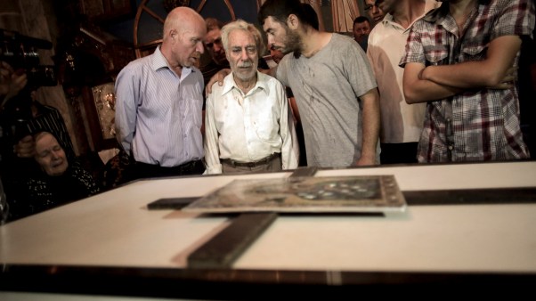 Relatives mourn over the coffin of Jalila Ayyad, a 70-year-old Christian woman killed when her Gaza City home was destroyed in an Israeli air strike.