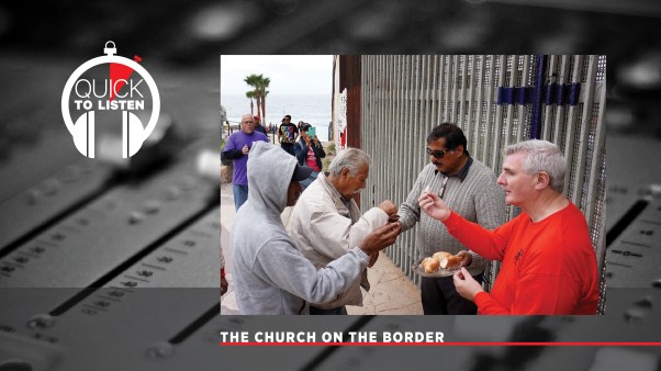 Worshipers take communion during a Mass along the U.S.-Mexico border wall