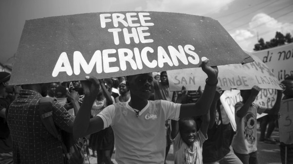 Haitians protest for the release of 17 kidnapped missionaries near the Ohio-based Christian Aid Ministries headquarters in Titanyen, north of Port-au-Prince, Haiti, on Tuesday, Oct. 19, 2021.