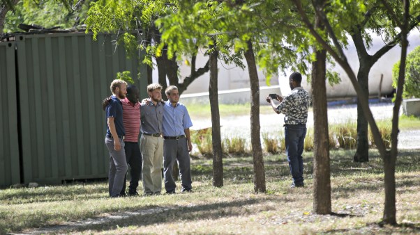 A man takes a photo of missionaries at the Christian Aid Ministries headquarters at Titanyen, north of Port-au-Prince, Haiti, on Thursday, Dec. 16, 2021.