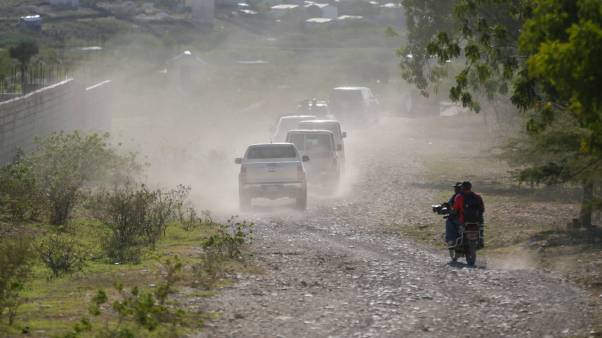 After the final 12 kidnapped missionaries were free, a caravan drives to the airport after departing from the Christian Aid Ministries headquarters at Titanyen, north of Port-au-Prince, Haiti, on December 16, 2021.