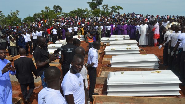 Coffins are prepared for burial during a funeral service for 17 worshippers and two priests, who were allegedly killed by Fulani herdsmen in Nigeria.