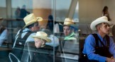 Group of Mennonite immigrants in the waiting room of Jorge Chavez International Airport in Peru.