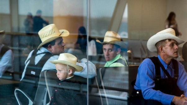 Group of Mennonite immigrants in the waiting room of Jorge Chavez International Airport in Peru.