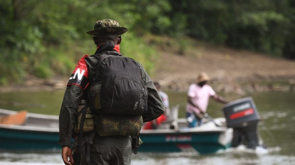 Rebels of the National Liberation Army patrol near the Baudo river in Colombia.