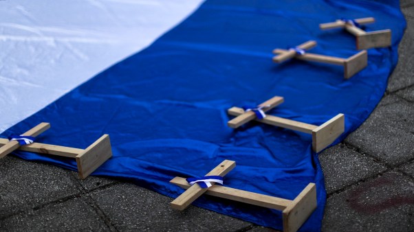 Crosses on top of a Nicaraguan flag.