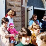 People in the 1970s walking out of a church