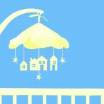 A baby crib mobile with stars and houses hanging from it.