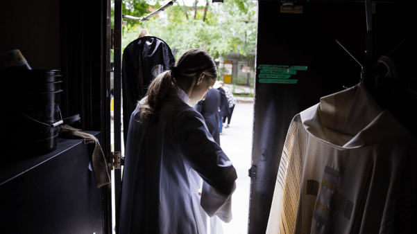 An Anglican minister prepares for worship in Canada