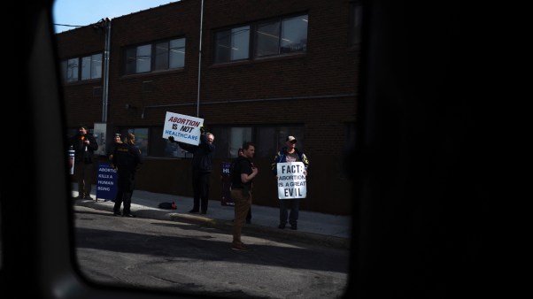 Pro-life protestors demonstrate outside of a Minnesota abortion clinic during the 2024 presidential campaign.