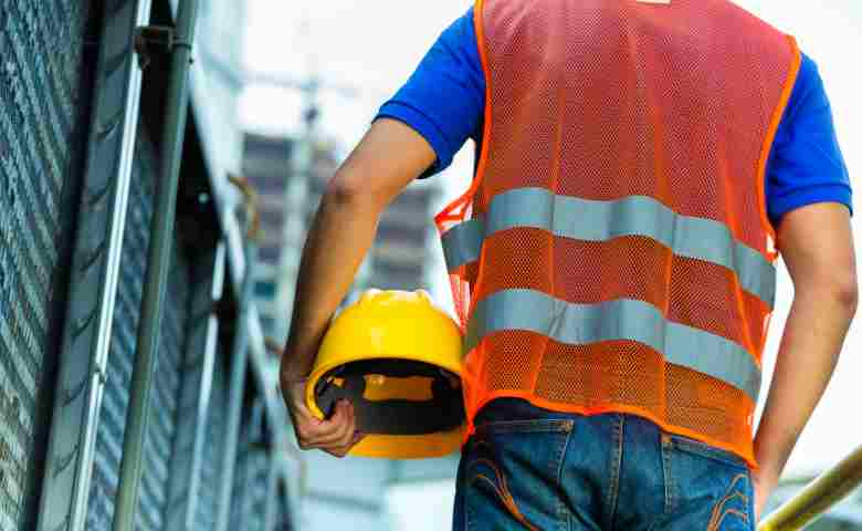 Construction worker overseeing building site