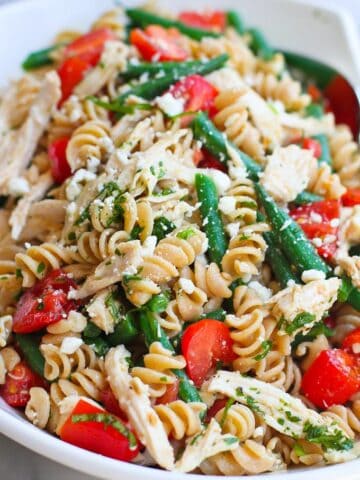 Chicken Pasta Salad with Green Beans, Tomatoes and Feta Cheese…This healthy side pasta salad with disappear in minutes at your next barbecue! 163 calories and 4 Weight Watchers Freestyle SP