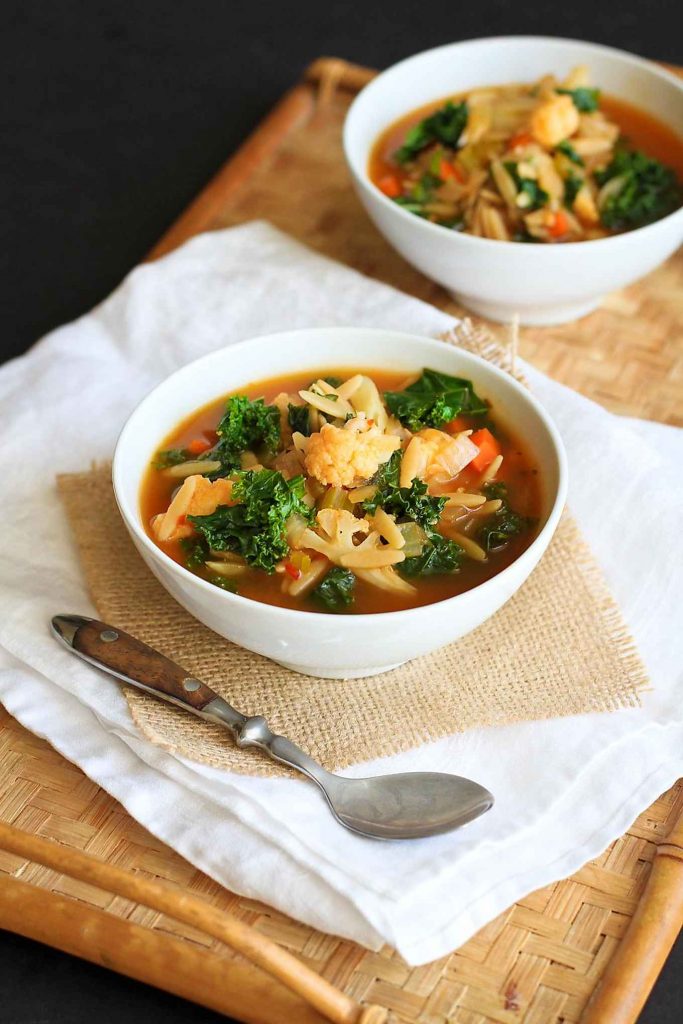 This vegetarian kale soup is packed with orzo and cauliflower. A hearty, healthy recipe for cold weather! 205 calories and 4 Weight Watchers Freestyle SP