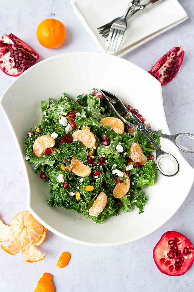 You can never go wrong with an easy kale salad recipe that is packed with pomegranates, oranges and goat cheese! 98 calories and 2 Weight Watchers Freestyle SP #salad #vegetarian