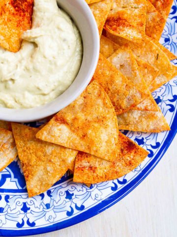 It takes mere minutes to make homemade baked tortilla chips. Sprinkled with smoked paprika and rosemary, these ones are something special! 78 calories and 2 Weight Watchers Freestyle SP #snacks #healthy #weightwatchers