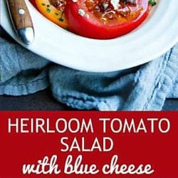 I can never stop eating this amazing Heirloom Tomato Salad. Topped with blue cheese crumbles and an easy vinaigrette. 86 calories and 3 Weight Watchers Freestyle SP #tomatorecipes #weightwatchers #healthyeating