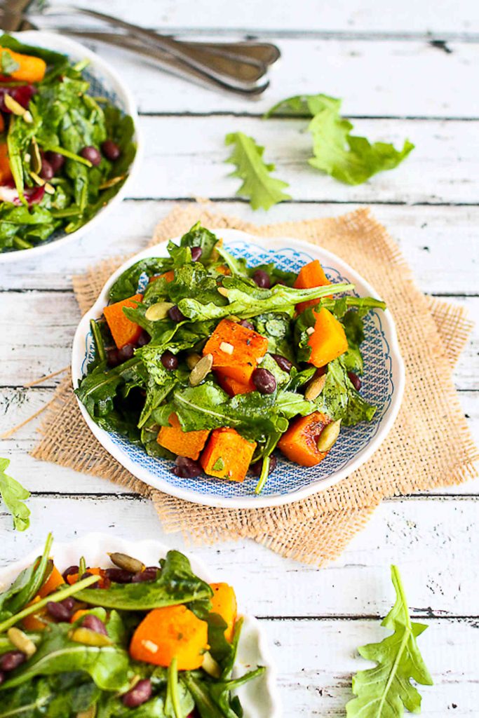 Butternut squash, black beans, arugula and a zippy dressing are fantastic together as a vegan dinner recipe on a busy weeknight. 219 calories and 2 Weight Watchers SP | Warm | Arugula | Vegan | Vegetarian | Black Beans | Healthy #veganrecipes #vegandinner #weightwatchersrecipes 