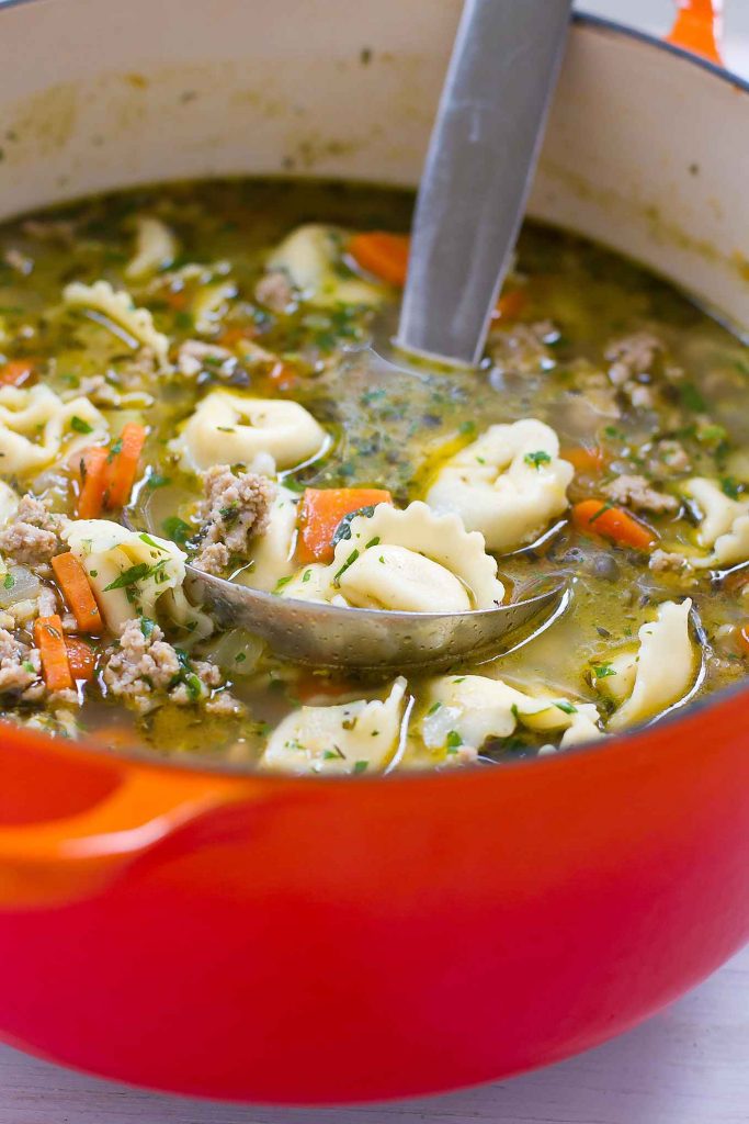 This easy tortellini soup has been a long time family favorite. A healthy 30-minute meal that tastes even better the next day. 230 calories and 4 Weight Watchers SP | Ground Turkey | Stovetop | Easy | Healthy | 30 Minute Meal | Recipes | Broth #tortellinisoup #30minutemeals #easydinnerrecipes #souprecipes #healthysoups #weightwatchers #smartpoints